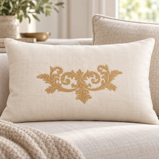 Single-color old-gold floral scroll machine embroidery on a warm ivory linen lumbar cushion