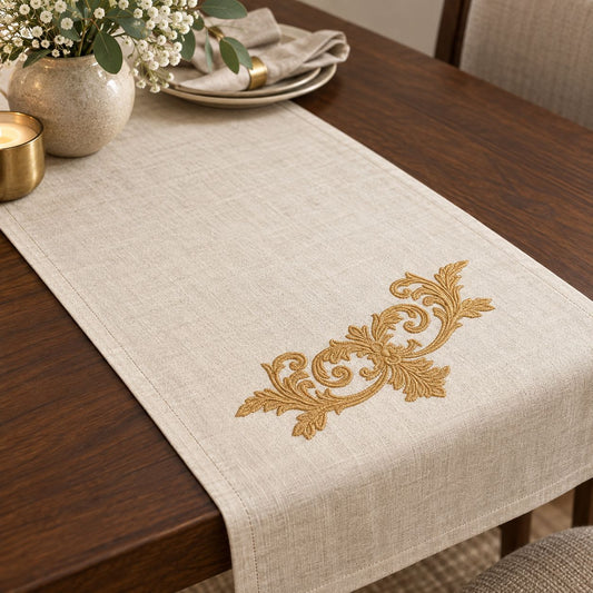 Old-gold floral scroll machine embroidery used as one placement on an oatmeal linen table runner
