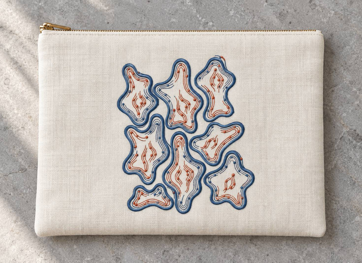 Organic Contour Dot Composition embroidered in smoky indigo and warm terracotta on a linen zip folio, showing the complete two-color motif.