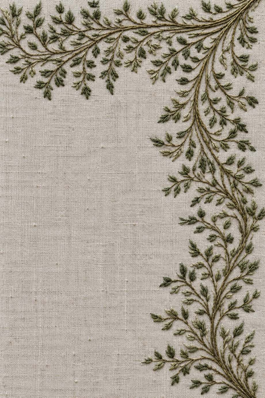 Delicate olive and sage cotton leafy vine border turns around a corner on warm stone grey linen.