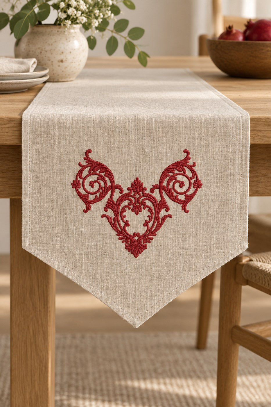 Single-color pomegranate ornamental crest machine embroidery on a natural linen table runner