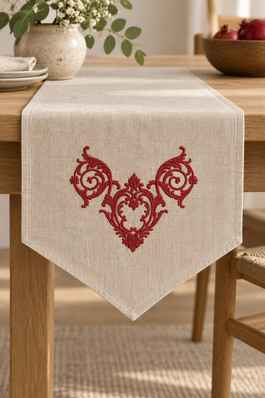 Single-color pomegranate ornamental crest machine embroidery on a natural linen table runner