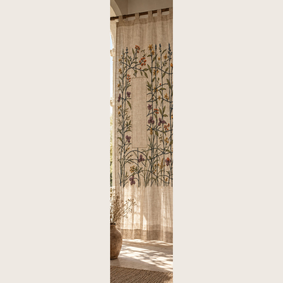 Hanging botanical panel mockup featuring the Quiet Loom Garden hand embroidery design. Fine stems cross among scattered blossoms around a tall area of clear linen.
