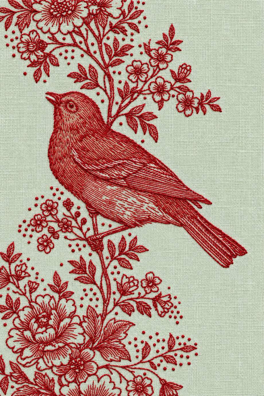 Embroidery visualization of songbird and arching blossom branch in one red cotton thread color on pale celadon linen.