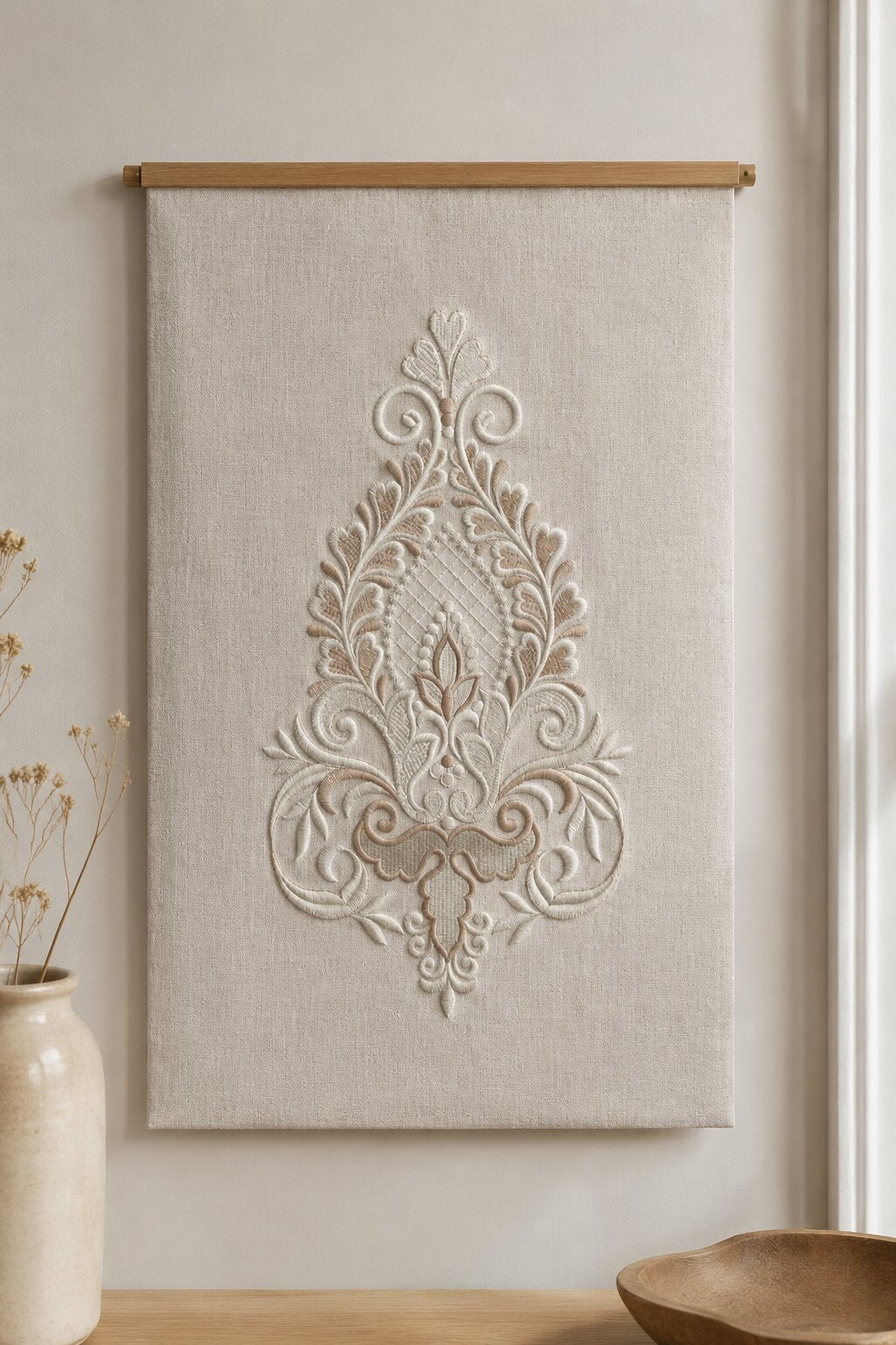 Large silver damask teardrop embroidery stitched on a natural linen wall panel with a simple light wood hanger