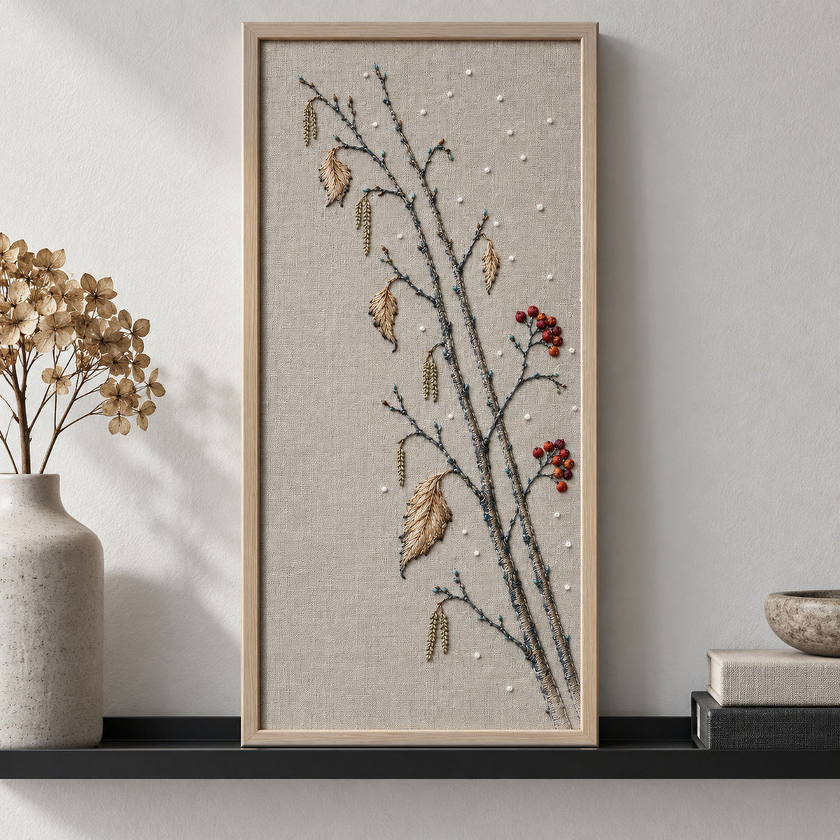 Linen notebook cover mockup featuring the Snow Birch and Red Thread Berries hand embroidery design. Pale birch trunks, catkins and dried leaves cross a snow-dotted field with red berry accents.